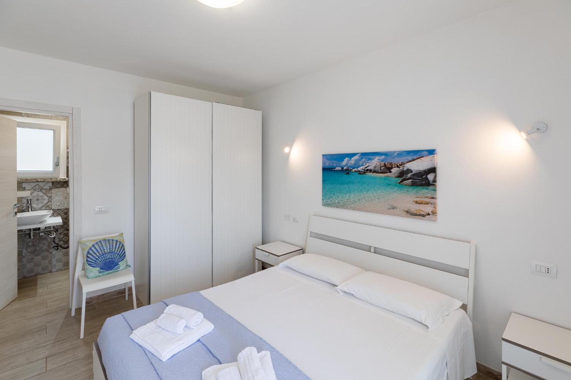 Case Vacanze "Bianco Mare" Porto Pino Pokoj fotografie