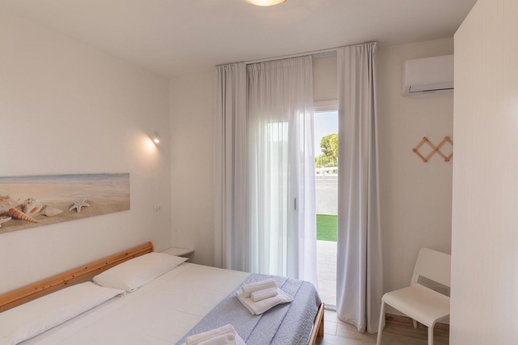 Case Vacanze "Bianco Mare" Porto Pino Pokoj fotografie